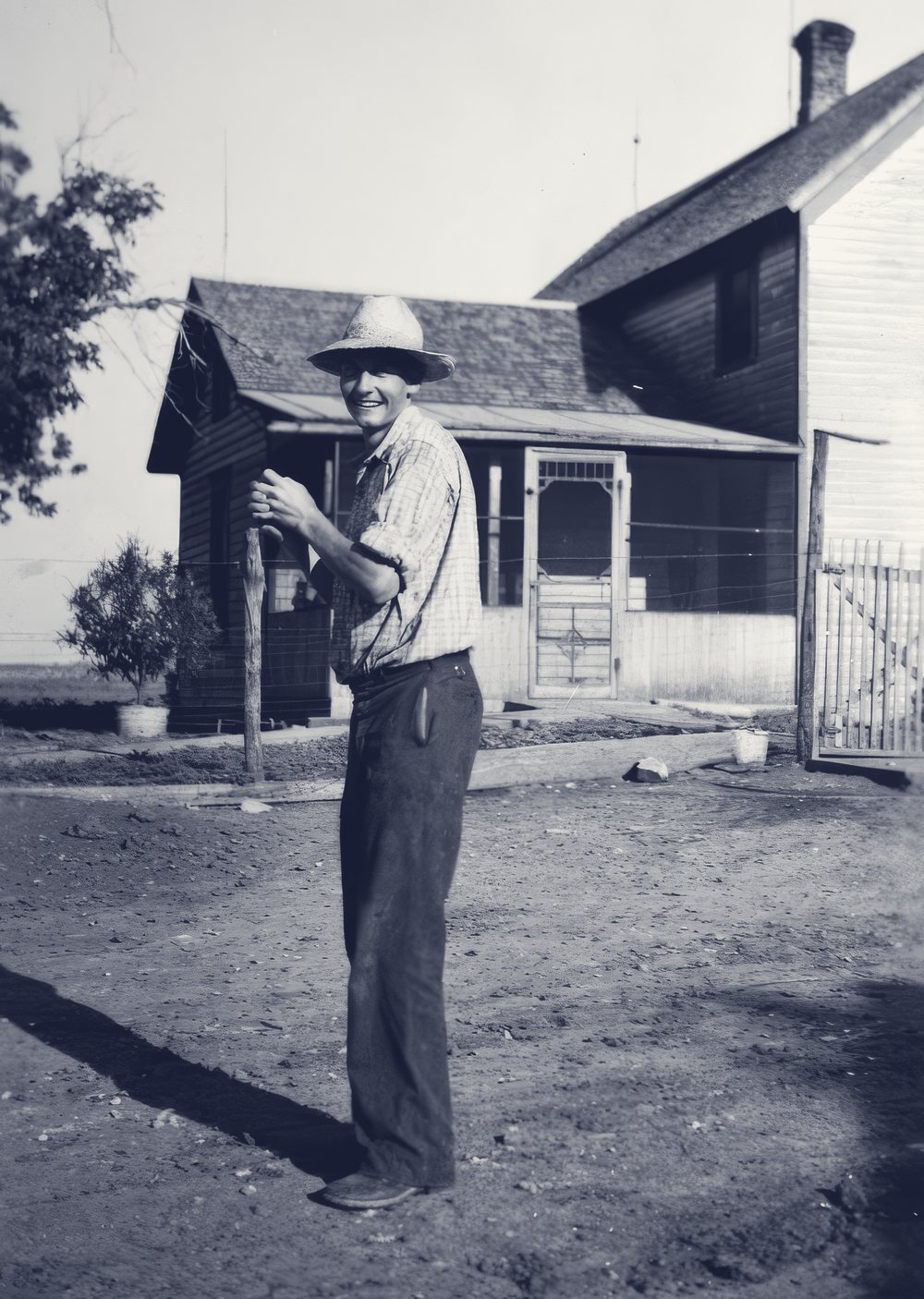 Father Emil Kapaun playing baseball at his family home in Pilsen, Kansas